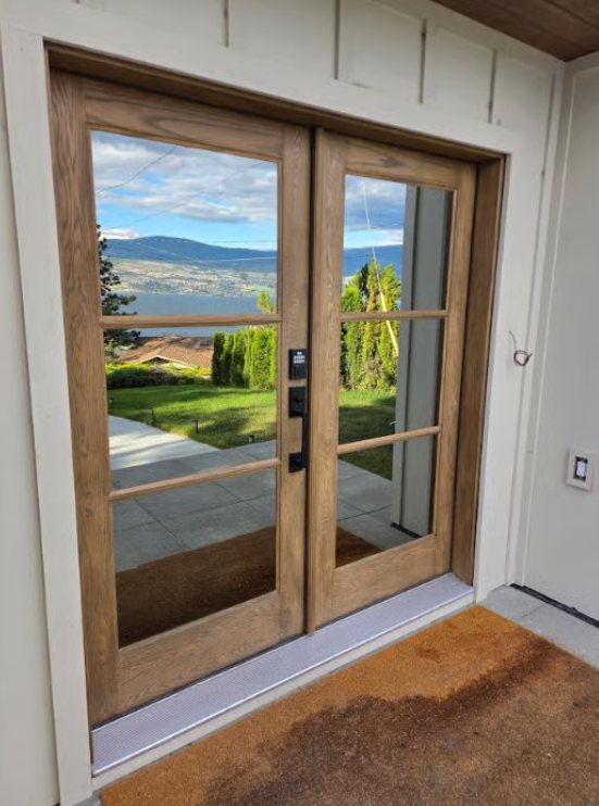 Freshly finished wood French doors overlooking the Okanagan valley